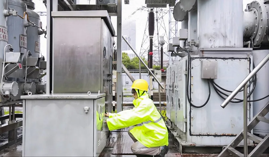 Electrical equipment environmental inspection in rainy conditions showing compartment access and sealing review