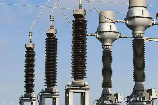 High-voltage transformer bushings installed on substation equipment