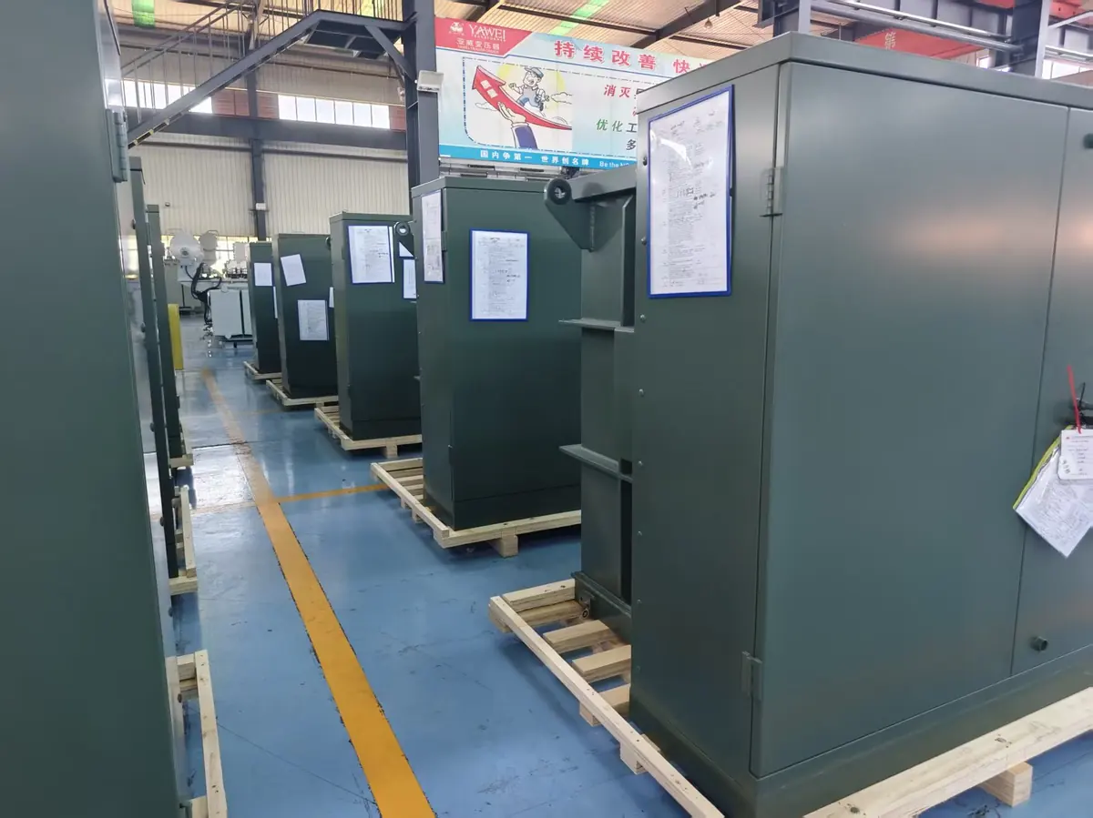 Pad mounted transformer factory units lined up for inspection and project delivery