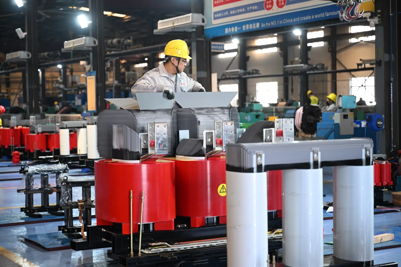 Transformer coil and core assembly for winding material review including copper aluminum and copper aluminum configuration
